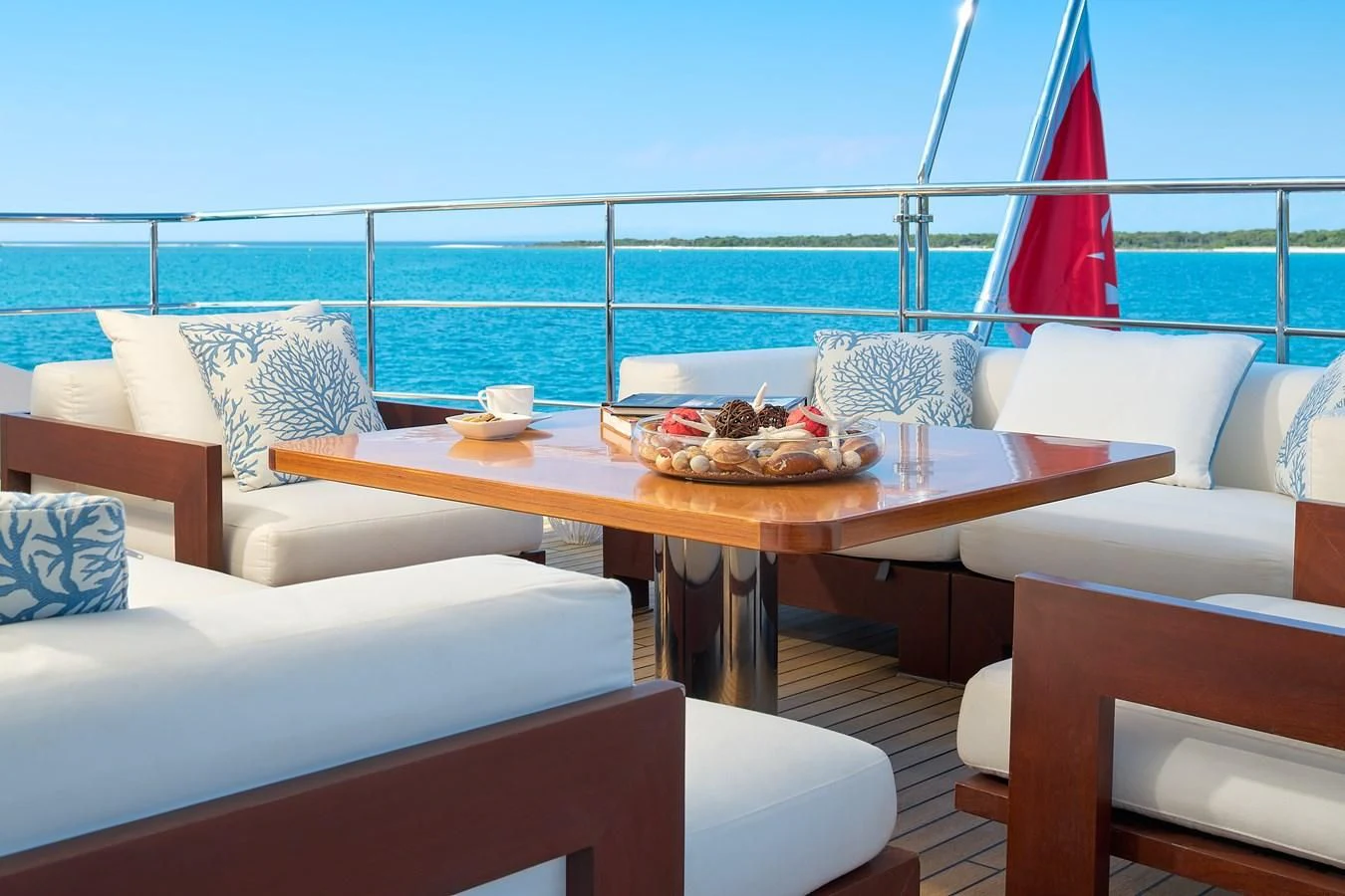 a table with chairs and a view of the ocean aboard LADY MRD Yacht for Charter