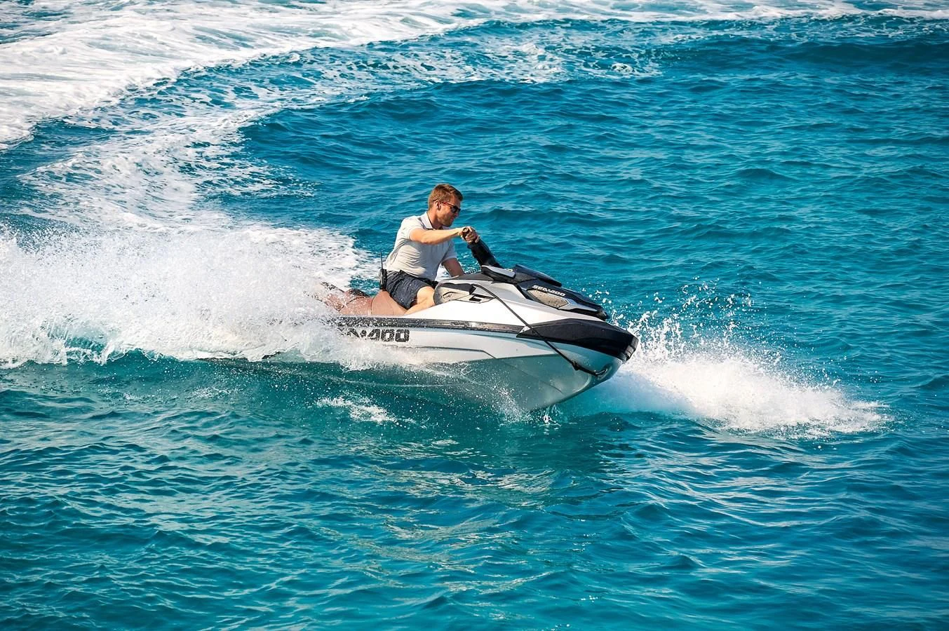 a man riding a jet ski aboard LADY MRD Yacht for Charter