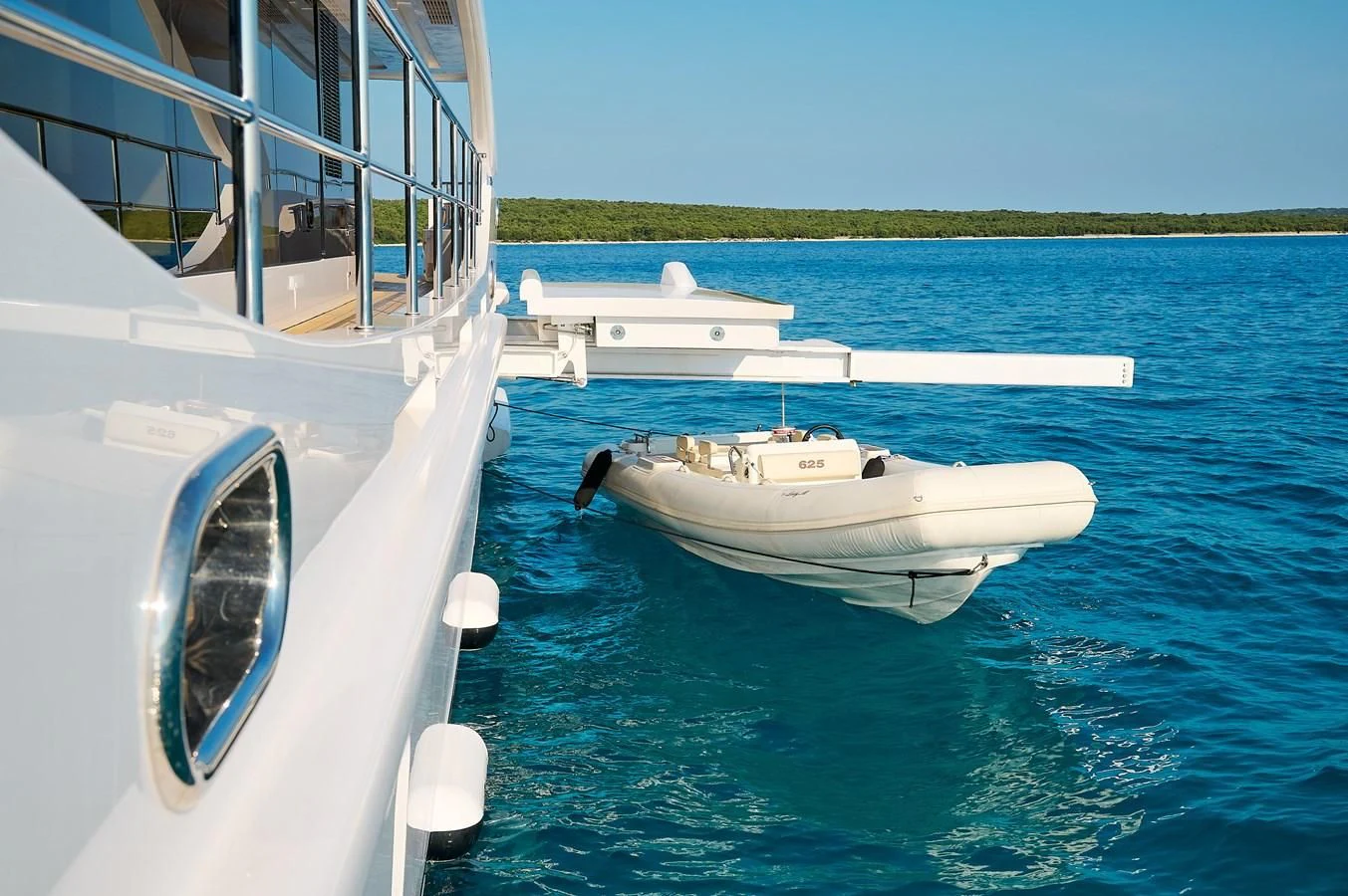 a couple of white boats in the water aboard LADY MRD Yacht for Charter