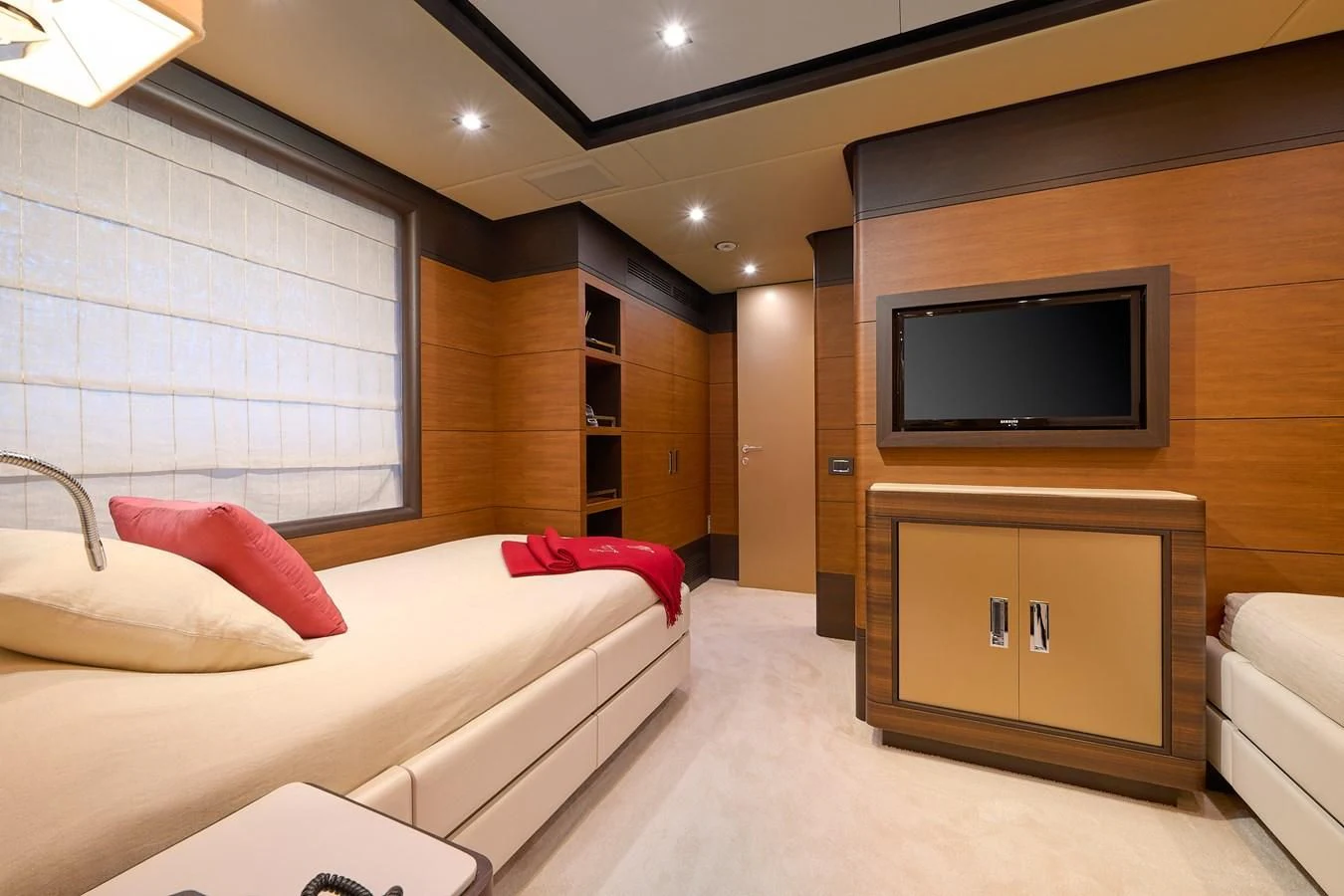 a room with a bed and a tv aboard LADY MRD Yacht for Charter