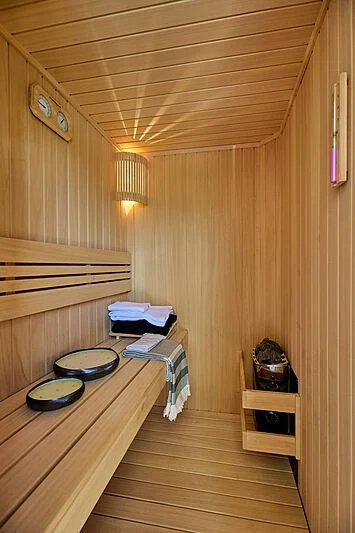 a wooden room with a bed and a table aboard VERONIKA Yacht for Sale