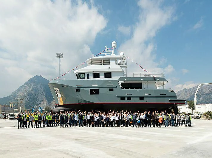 a large group of people standing in front of a ship aboard VERONIKA Yacht for Sale