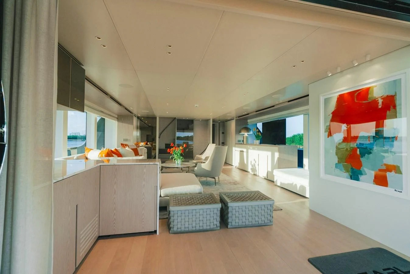 a room with a couch and a table and a tv aboard PEARL Yacht for Sale