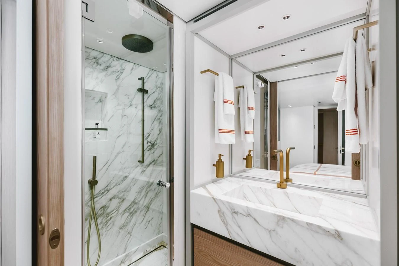 a bathroom with a large mirror aboard PEARL Yacht for Sale
