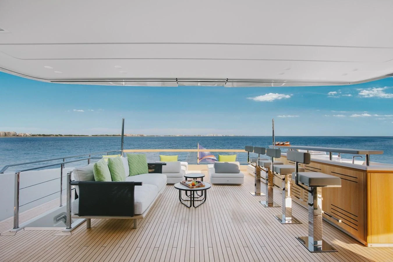 a balcony with a view of the ocean and beach aboard PEARL Yacht for Sale