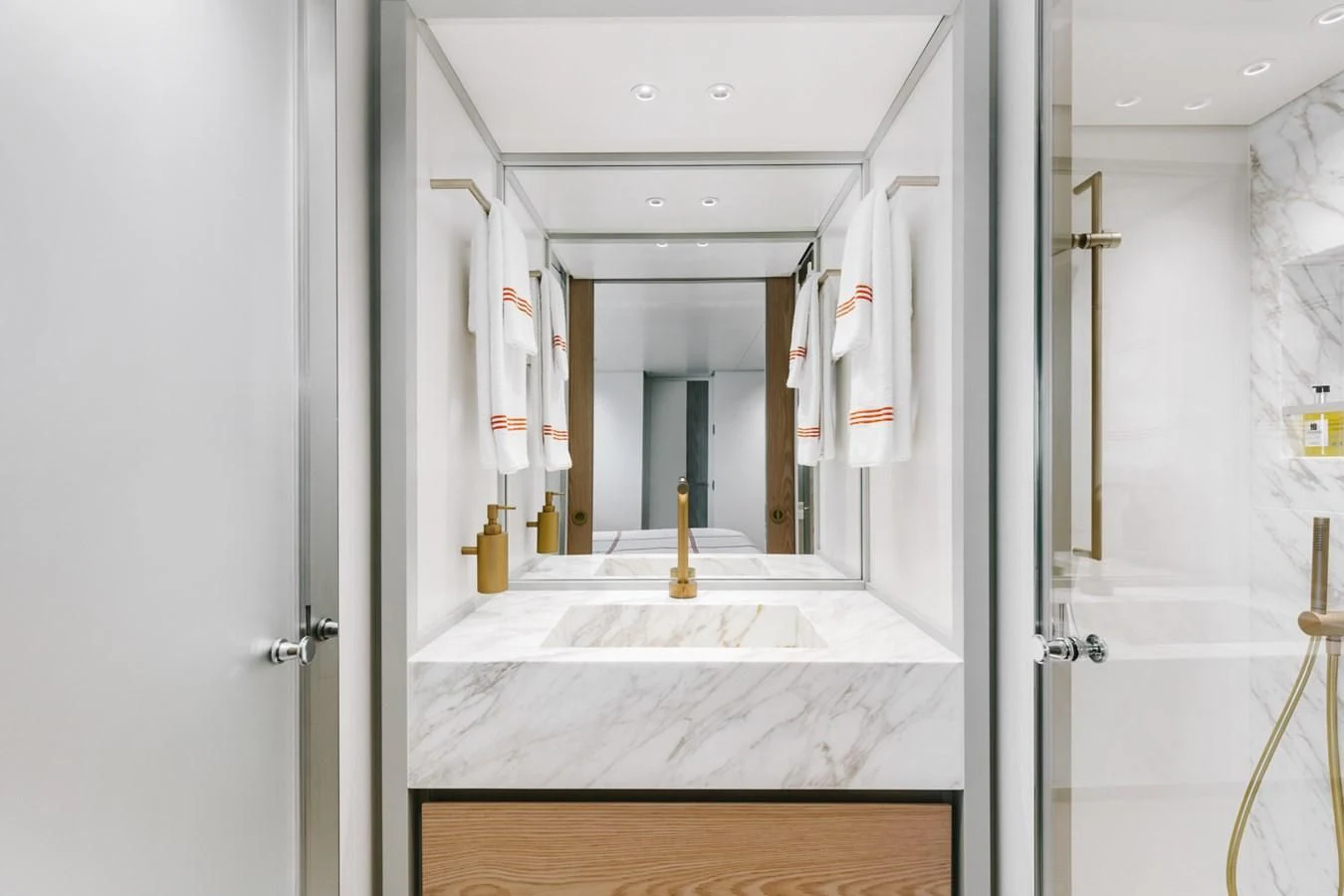a bathroom with a large mirror aboard PEARL Yacht for Sale