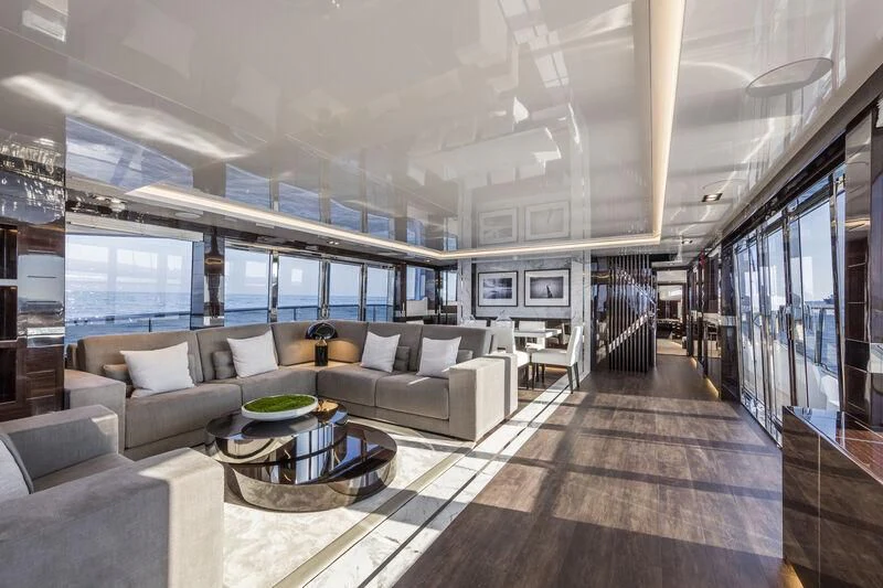 a large living room with a large window aboard PEARL Yacht for Sale