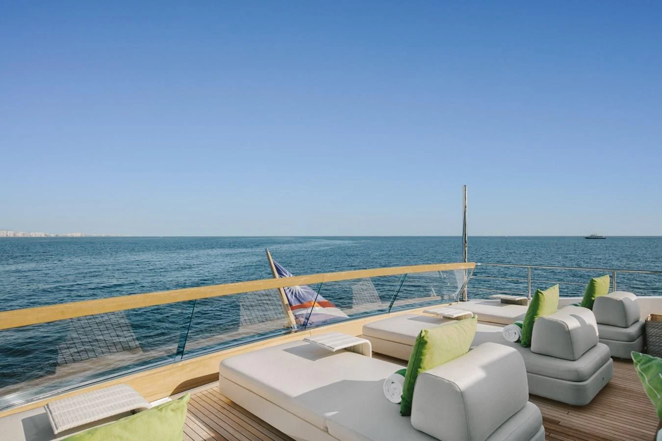 a lounge chair on a deck overlooking the ocean aboard PEARL Yacht for Sale