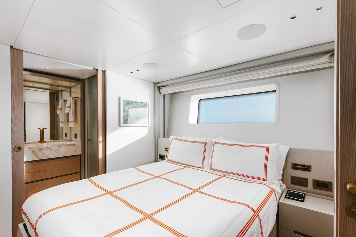 a room with a bed and a mirror aboard PEARL Yacht for Sale