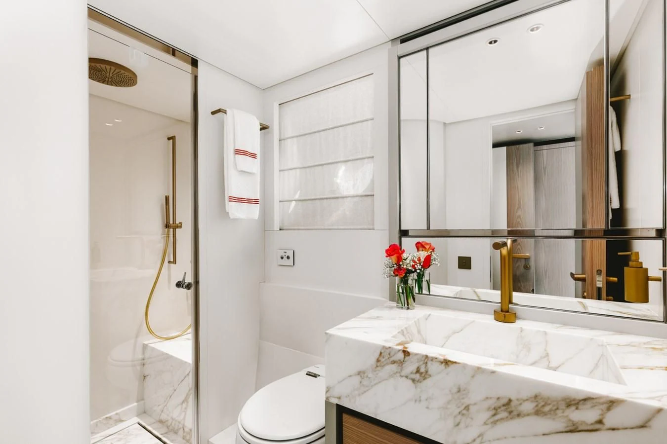 a bathroom with a large mirror aboard PEARL Yacht for Sale