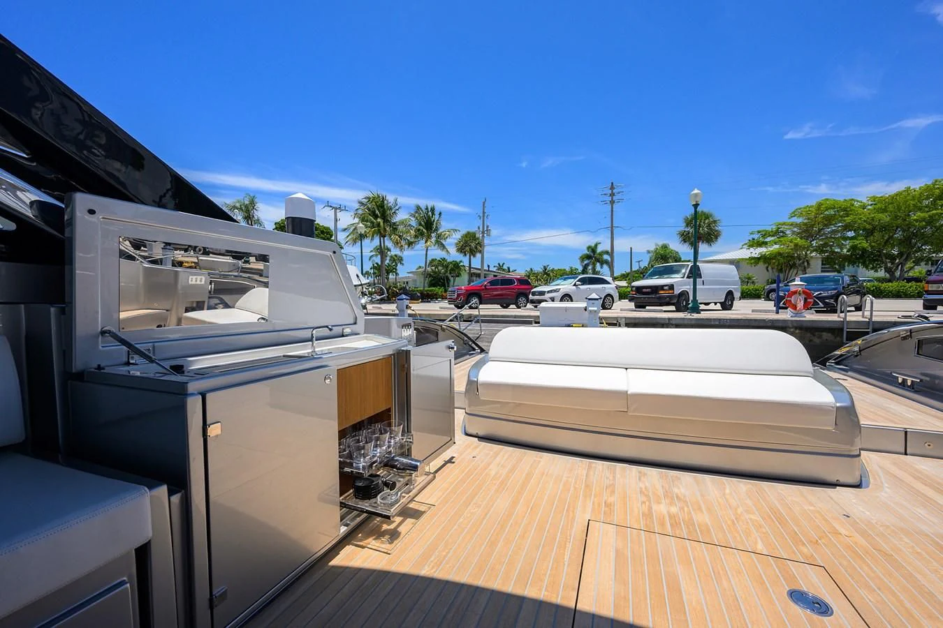 a deck with a deck and cars parked on it aboard JACQPOT Yacht for Sale