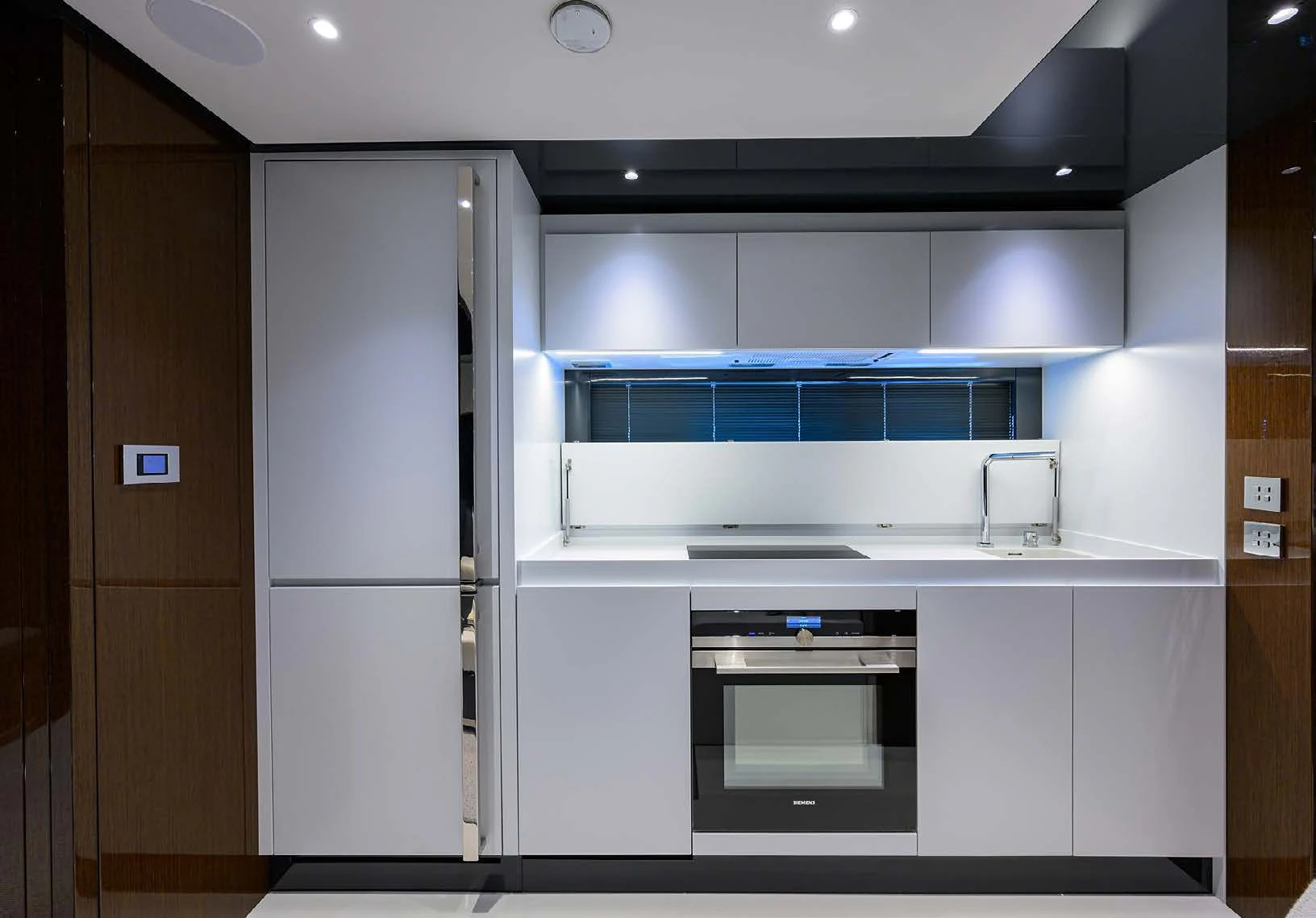 a kitchen with a refrigerator and a sink aboard JACQPOT Yacht for Sale