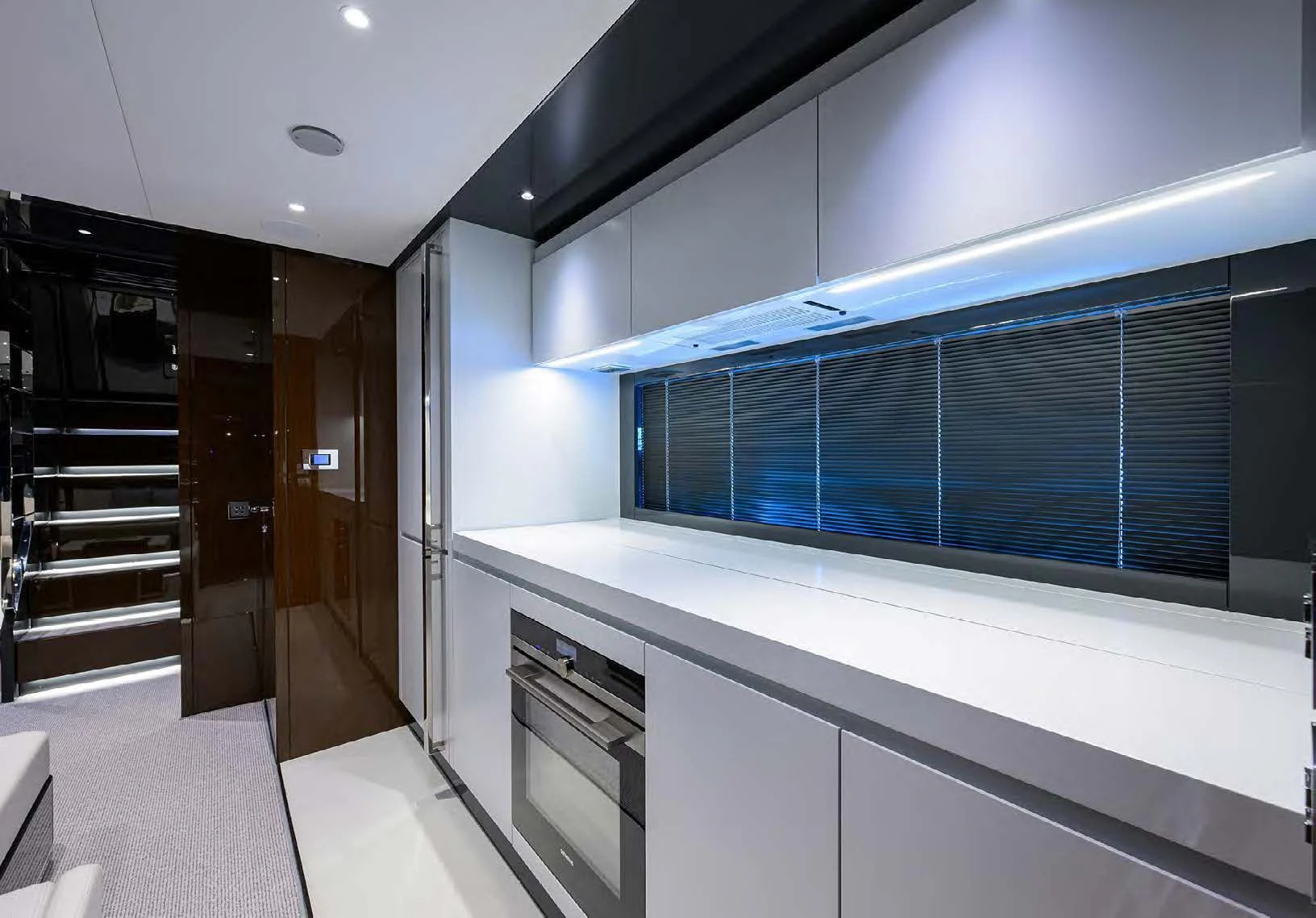 a room with a large window and a staircase aboard JACQPOT Yacht for Sale