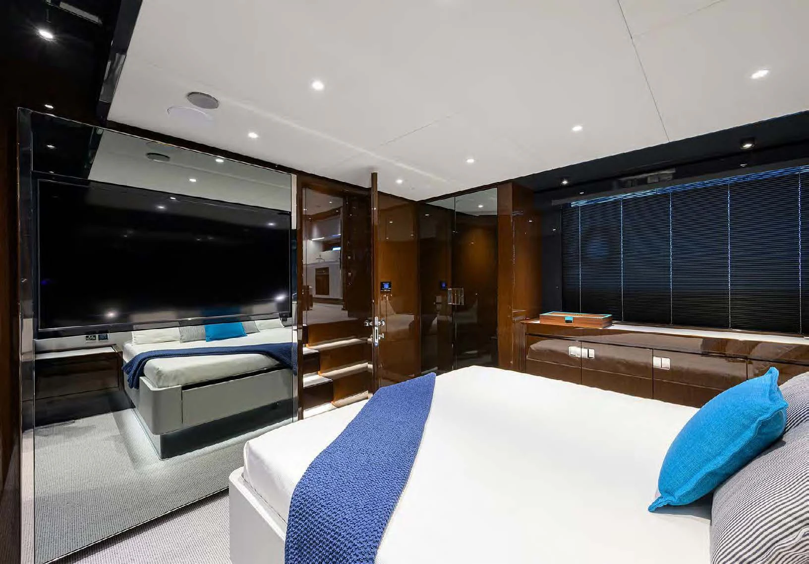 a room with a bed and a tv aboard JACQPOT Yacht for Sale