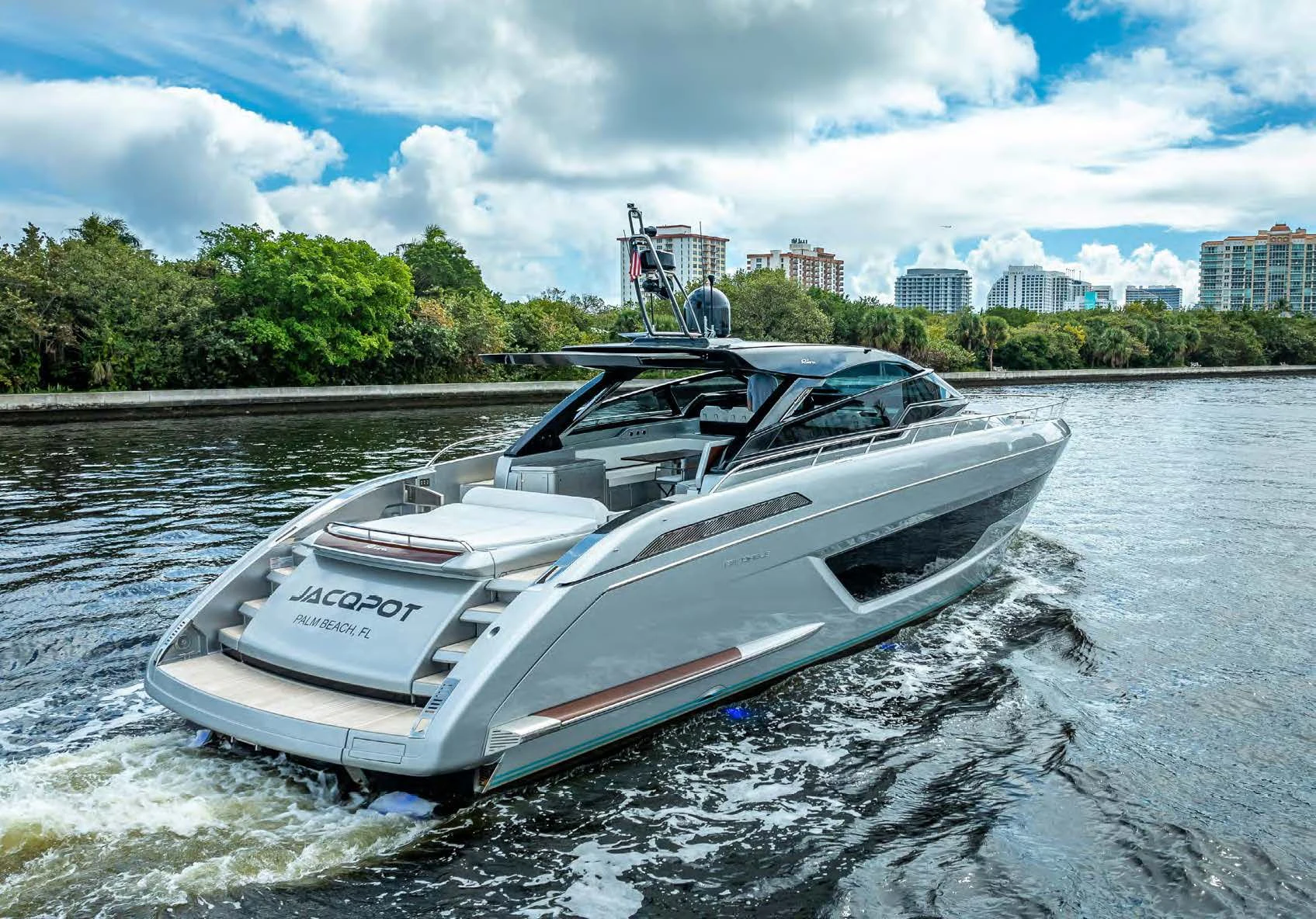a white boat on water aboard JACQPOT Yacht for Sale