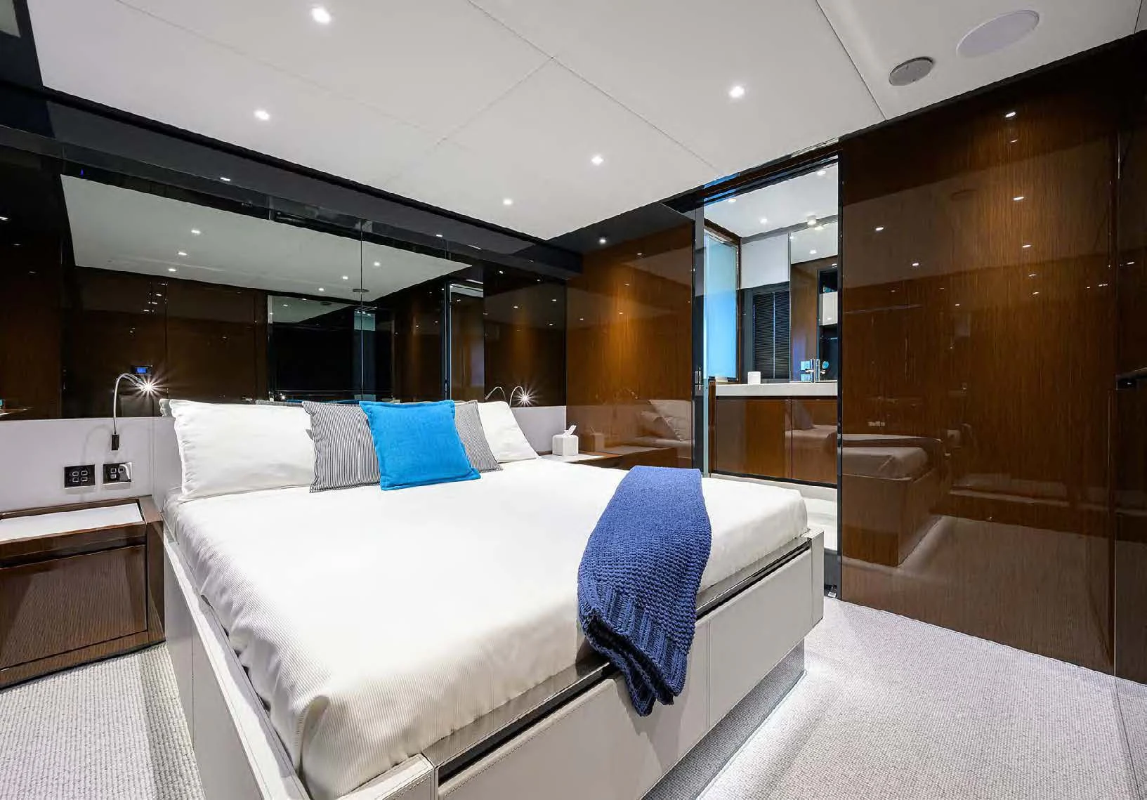 a large bed in a room aboard JACQPOT Yacht for Sale