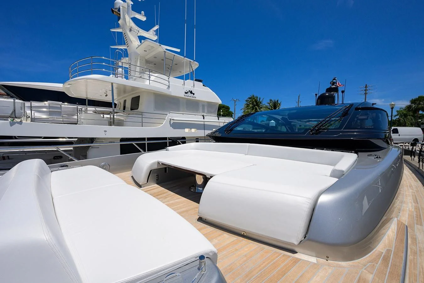 a boat parked next to a boat aboard JACQPOT Yacht for Sale
