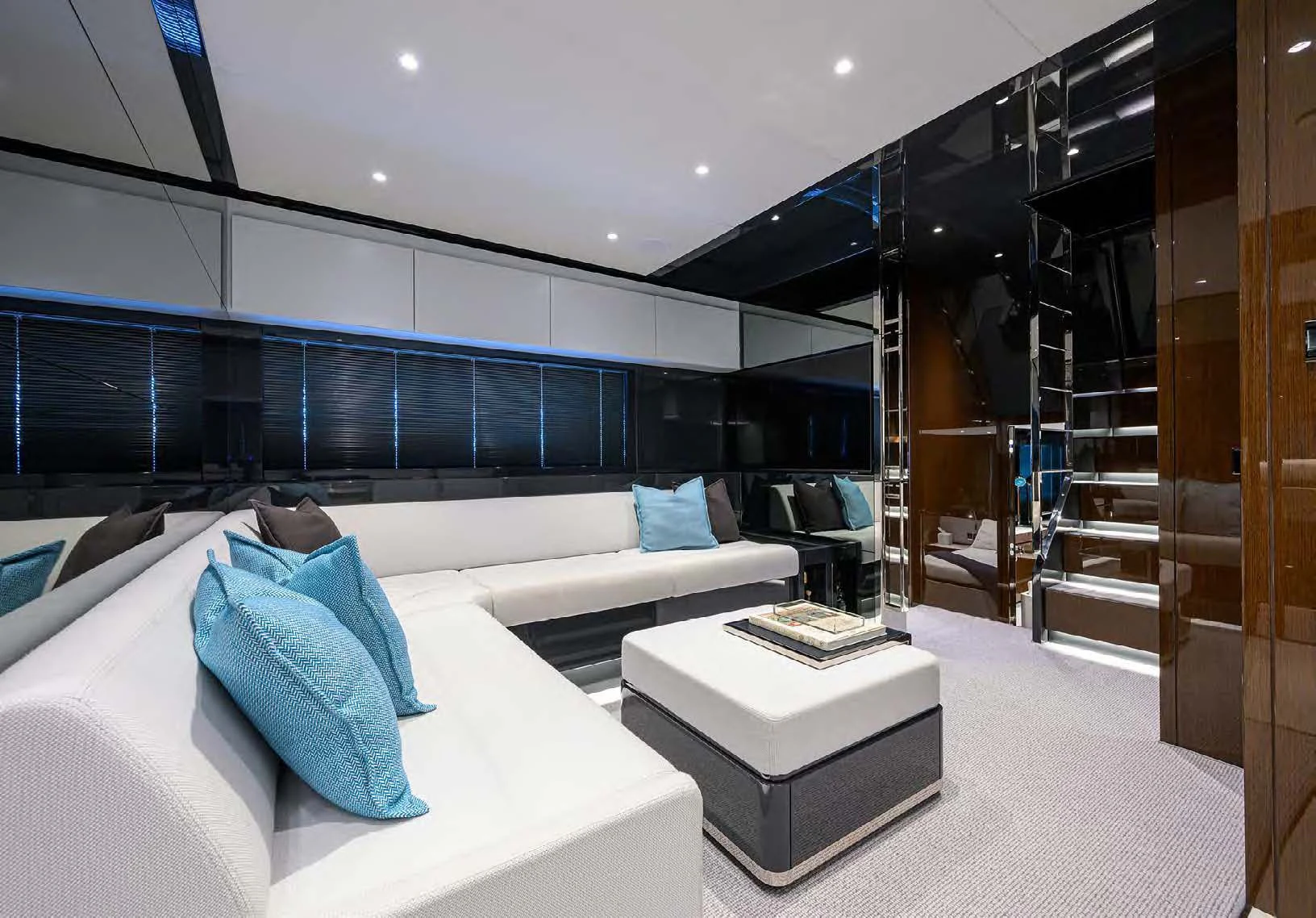 a room with a bed and a glass wall aboard JACQPOT Yacht for Sale