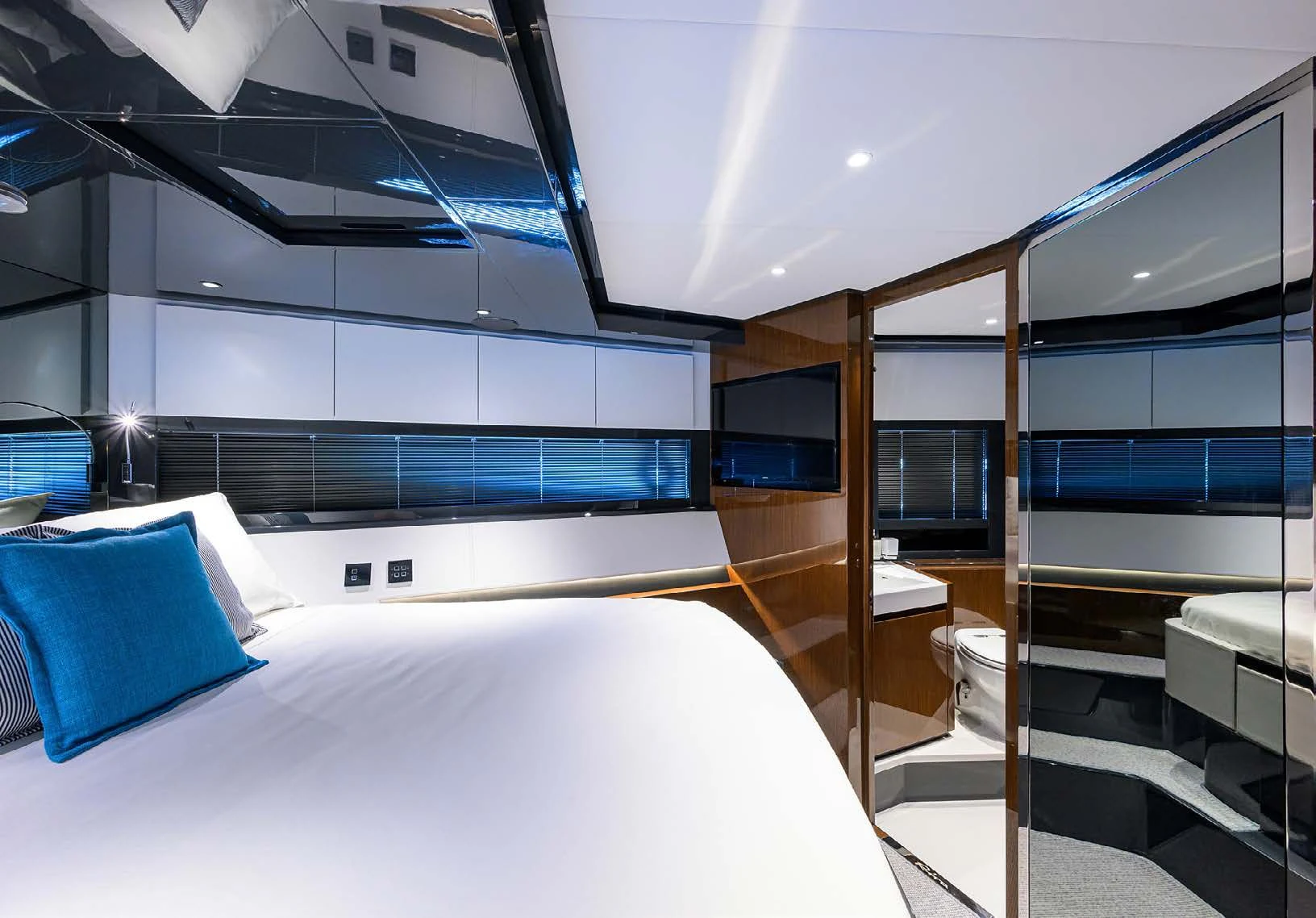 a room with a bed and a desk aboard JACQPOT Yacht for Sale