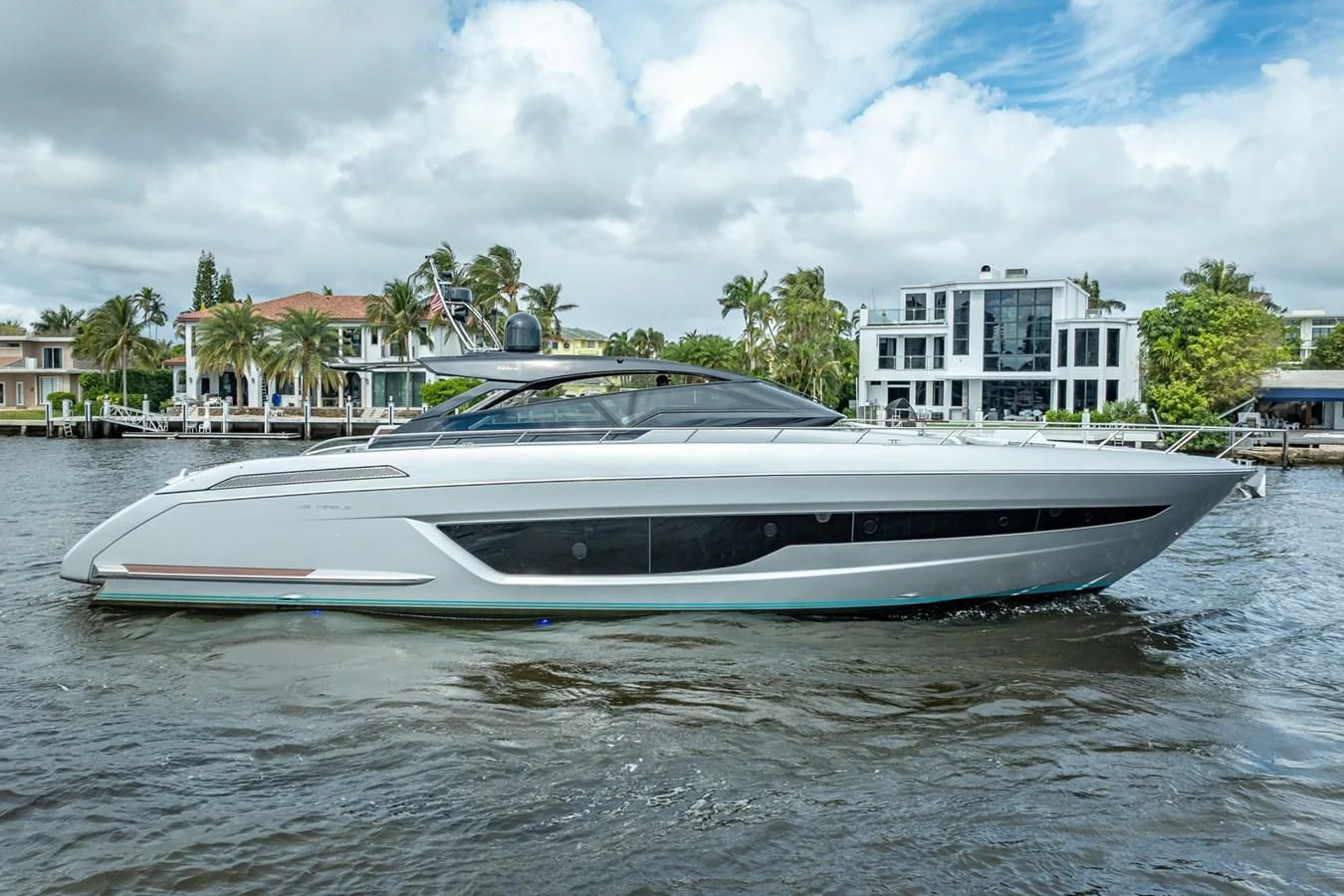 a white boat on a body of water aboard JACQPOT Yacht for Sale