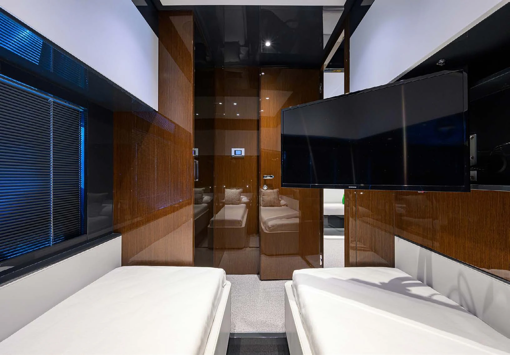 a room with a bed and a window aboard JACQPOT Yacht for Sale