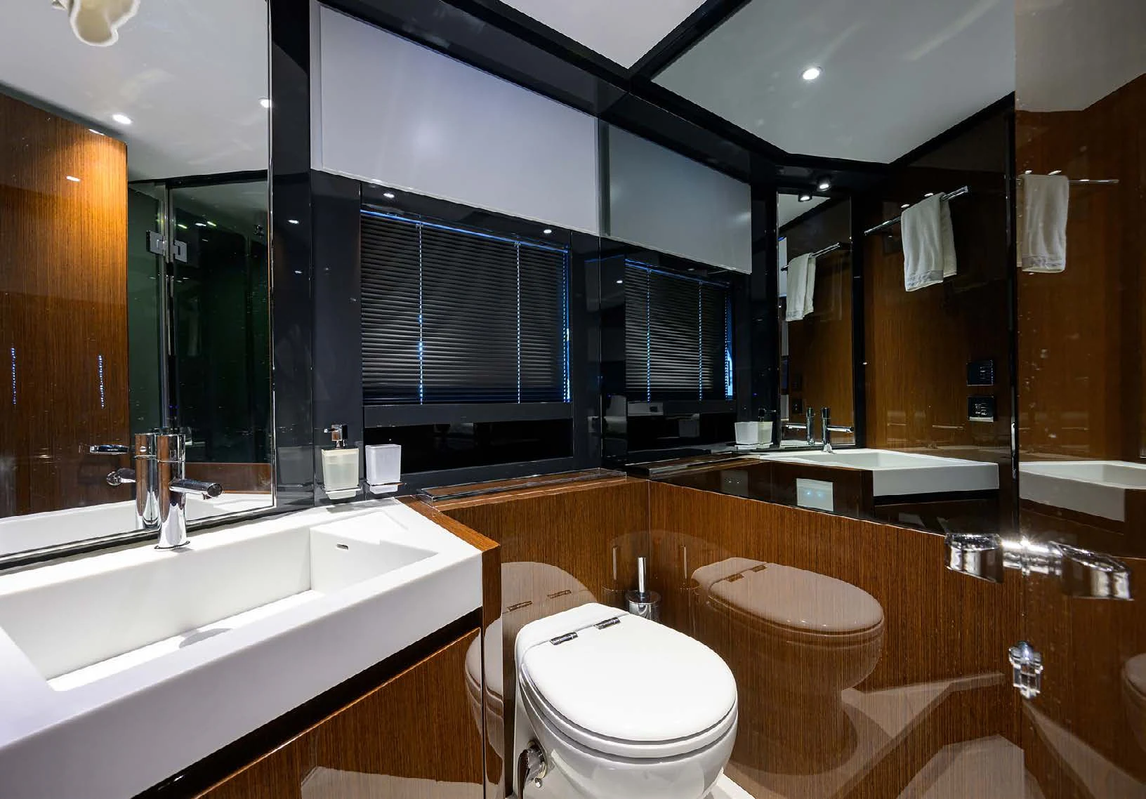 a bathroom with a large mirror aboard JACQPOT Yacht for Sale