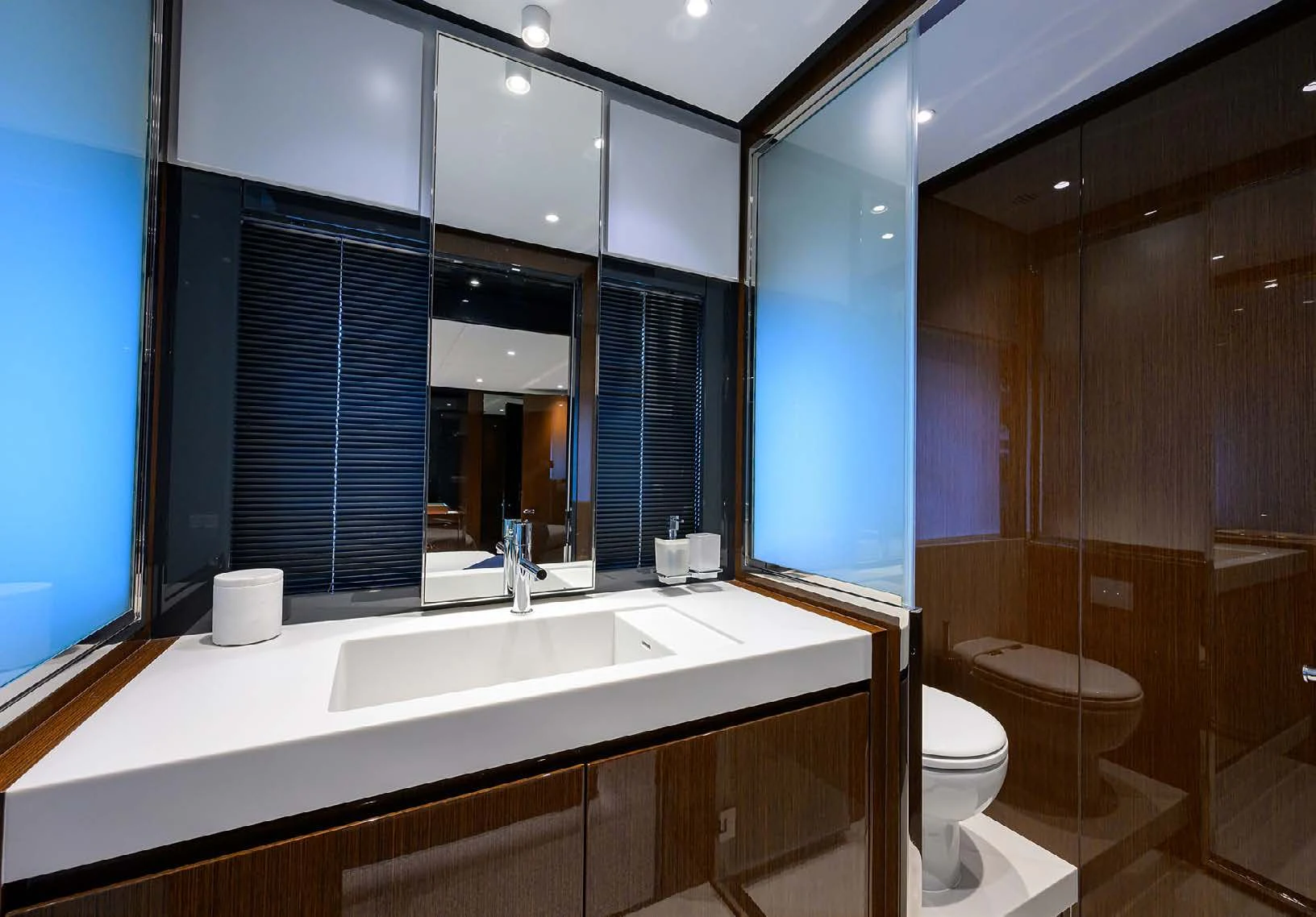 a bathroom with a large mirror aboard JACQPOT Yacht for Sale