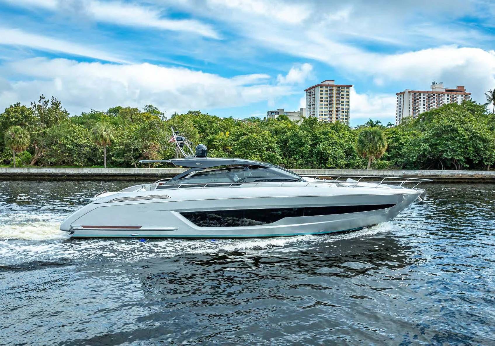 a white boat on a body of water aboard JACQPOT Yacht for Sale