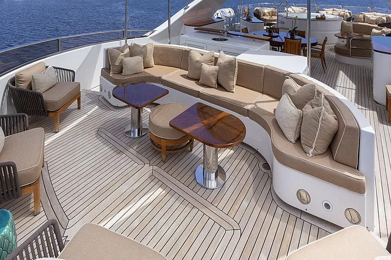 a deck with a couch and chairs aboard GROOVER Yacht for Sale