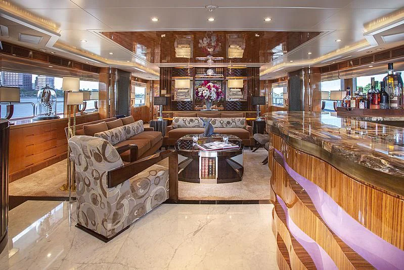 a living room with a couch and a table aboard GROOVER Yacht for Sale