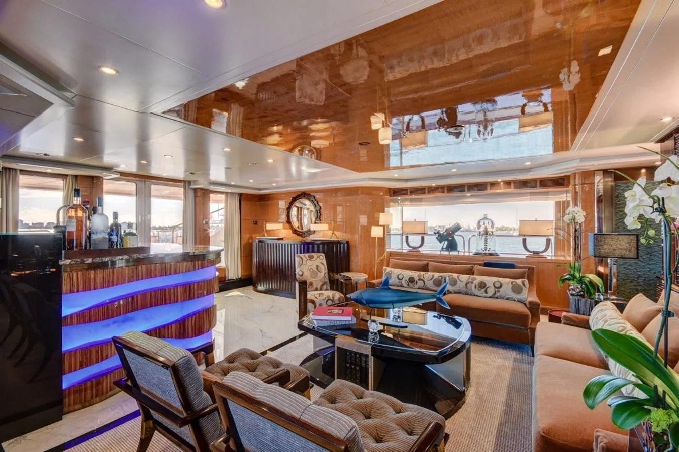 a living room with a fireplace aboard GROOVER Yacht for Sale