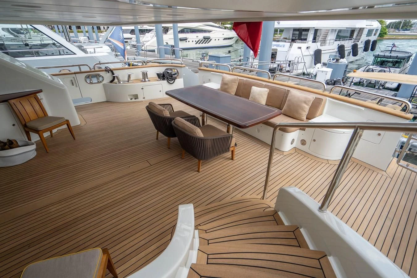 a room with a table and chairs aboard GROOVER Yacht for Sale