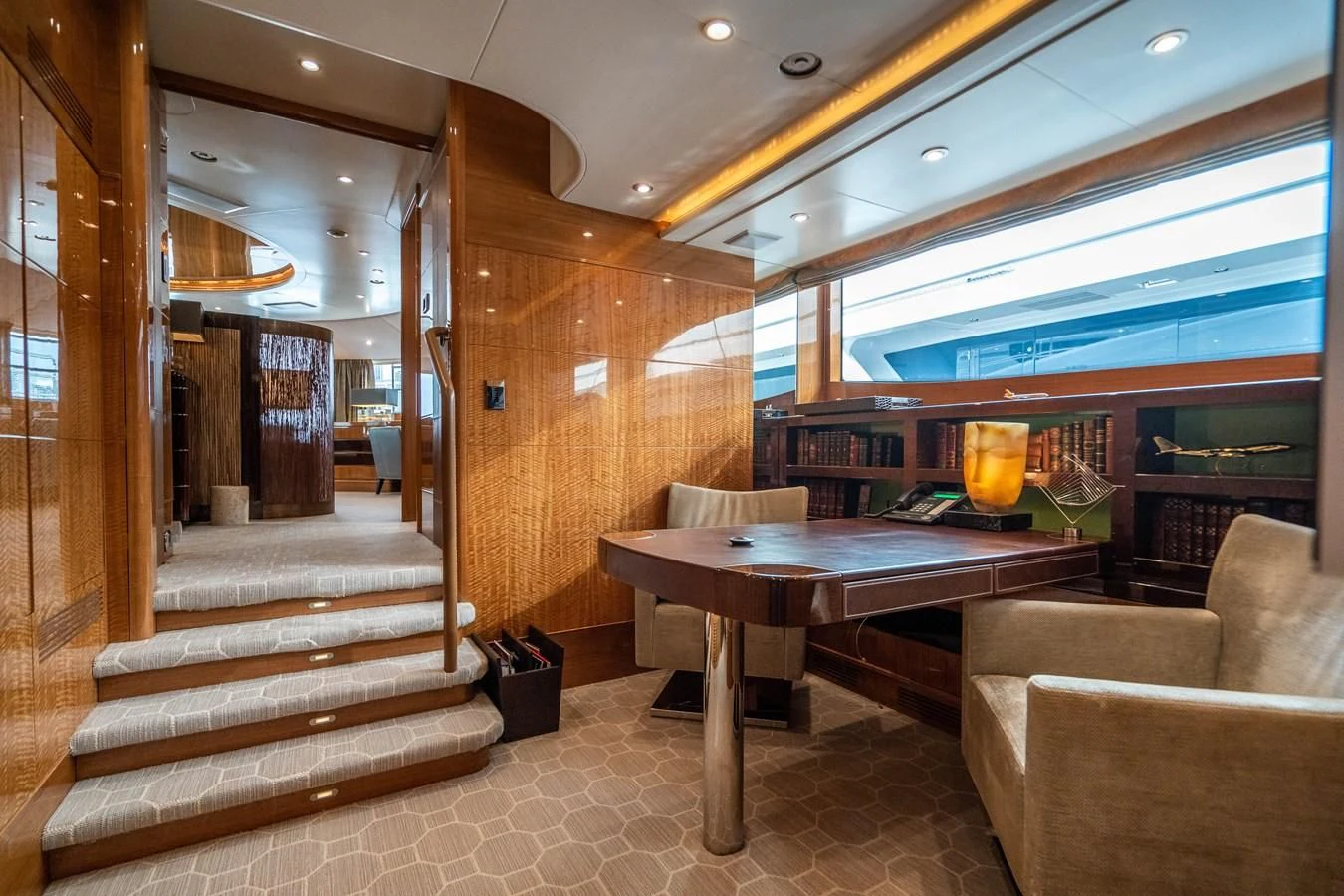 a room with a table and chairs aboard GROOVER Yacht for Sale