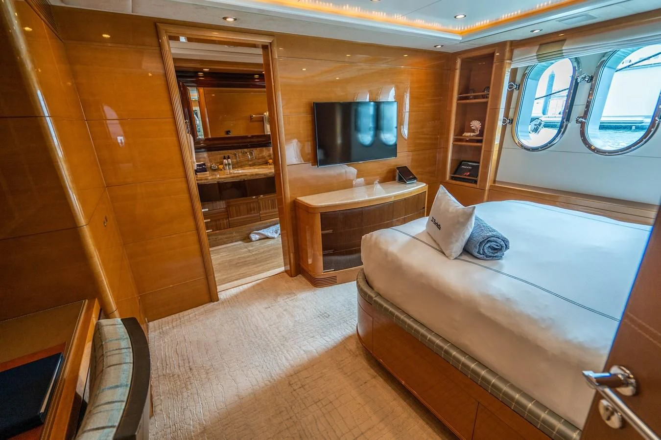 a room with a bed and a table aboard GROOVER Yacht for Sale