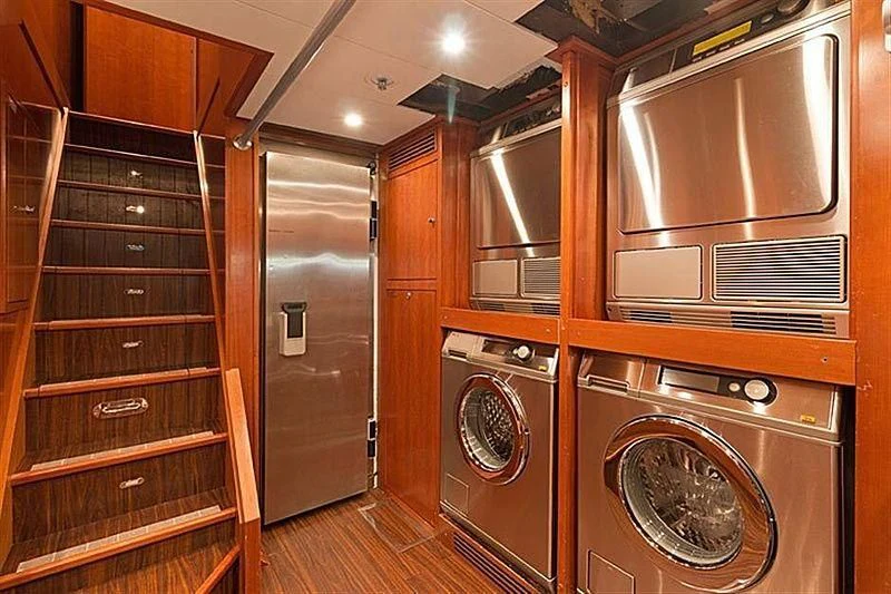 a room with a washer and dryer and dryer aboard GROOVER Yacht for Sale