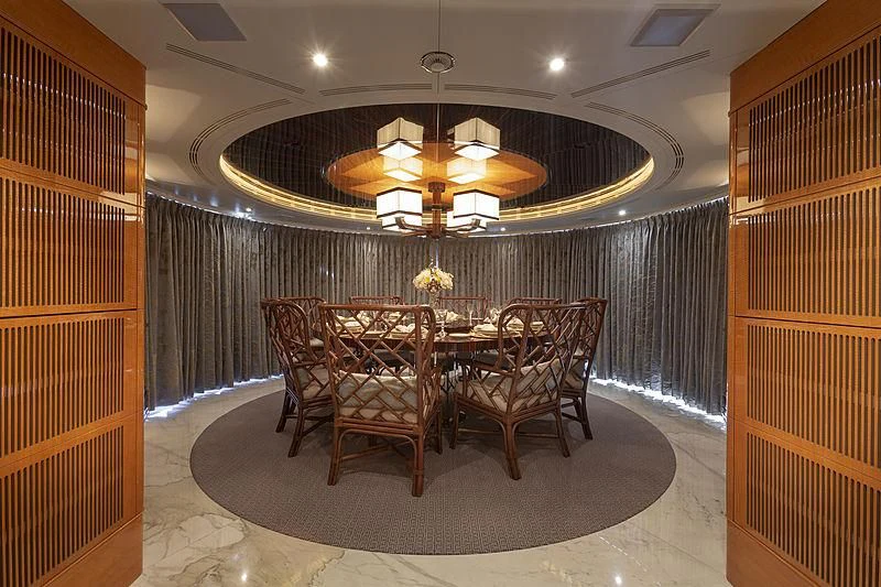 a dining room with a chandelier aboard GROOVER Yacht for Sale