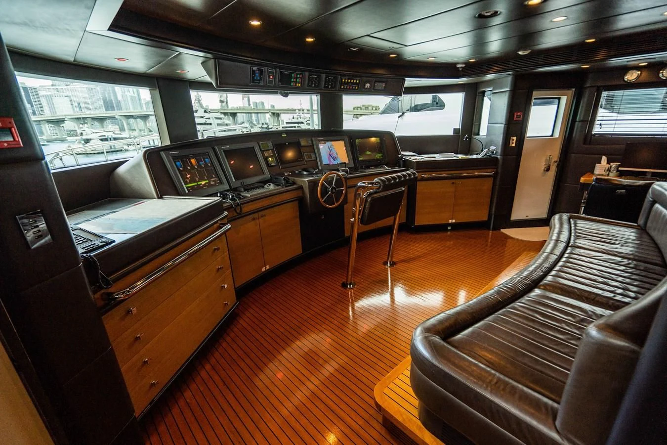 a room with a couch and a table and chairs aboard GROOVER Yacht for Sale