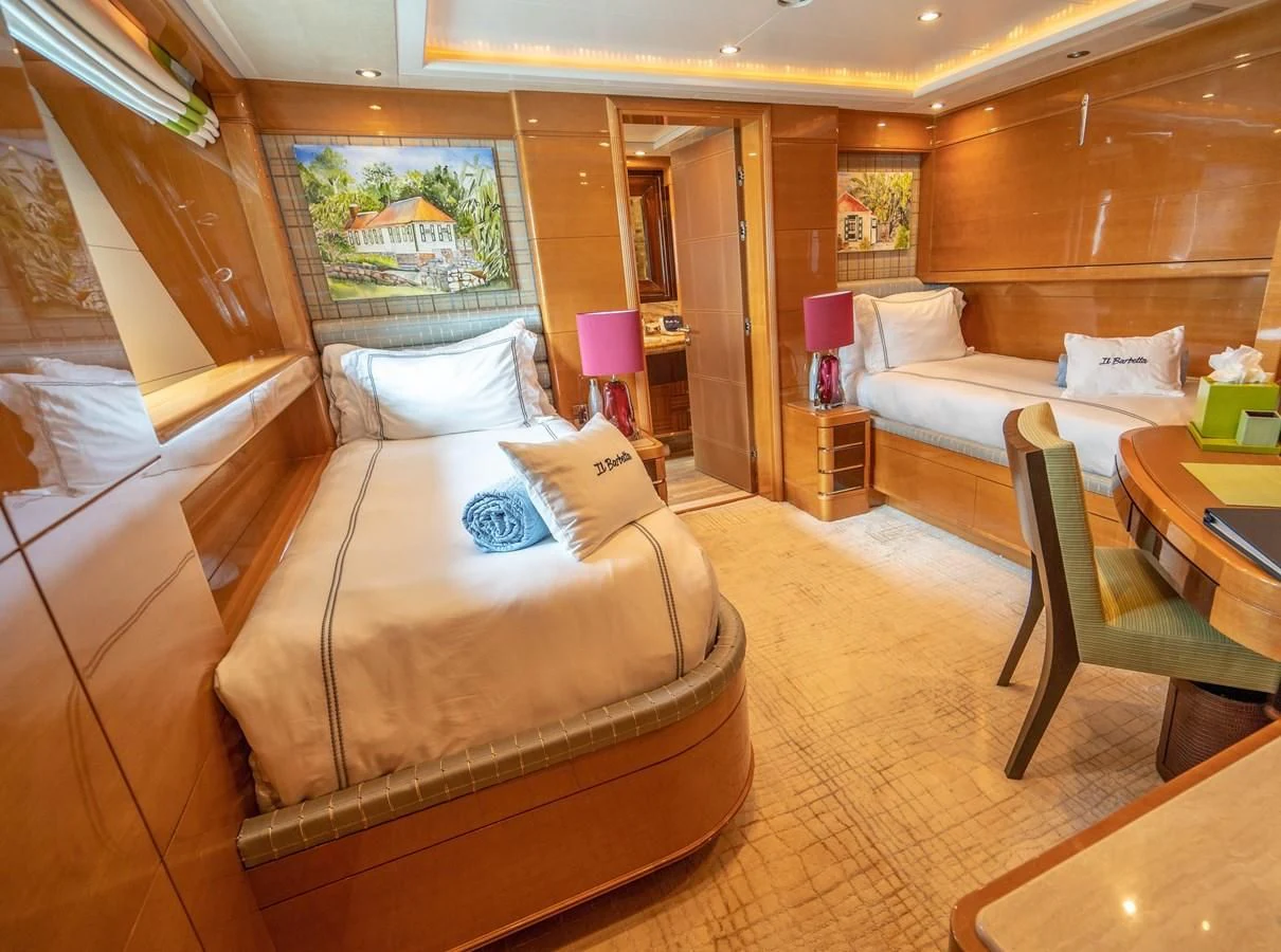 a room with a couch and a table aboard GROOVER Yacht for Sale