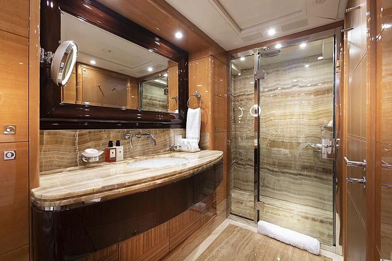 a bathroom with a large mirror aboard GROOVER Yacht for Sale