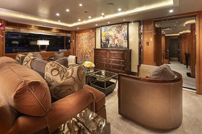 a living room with a fireplace aboard GROOVER Yacht for Sale