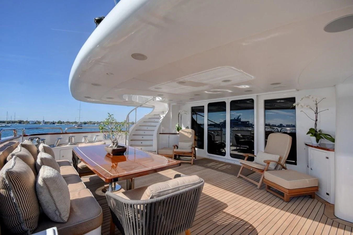 a living room with a large balcony aboard GROOVER Yacht for Sale