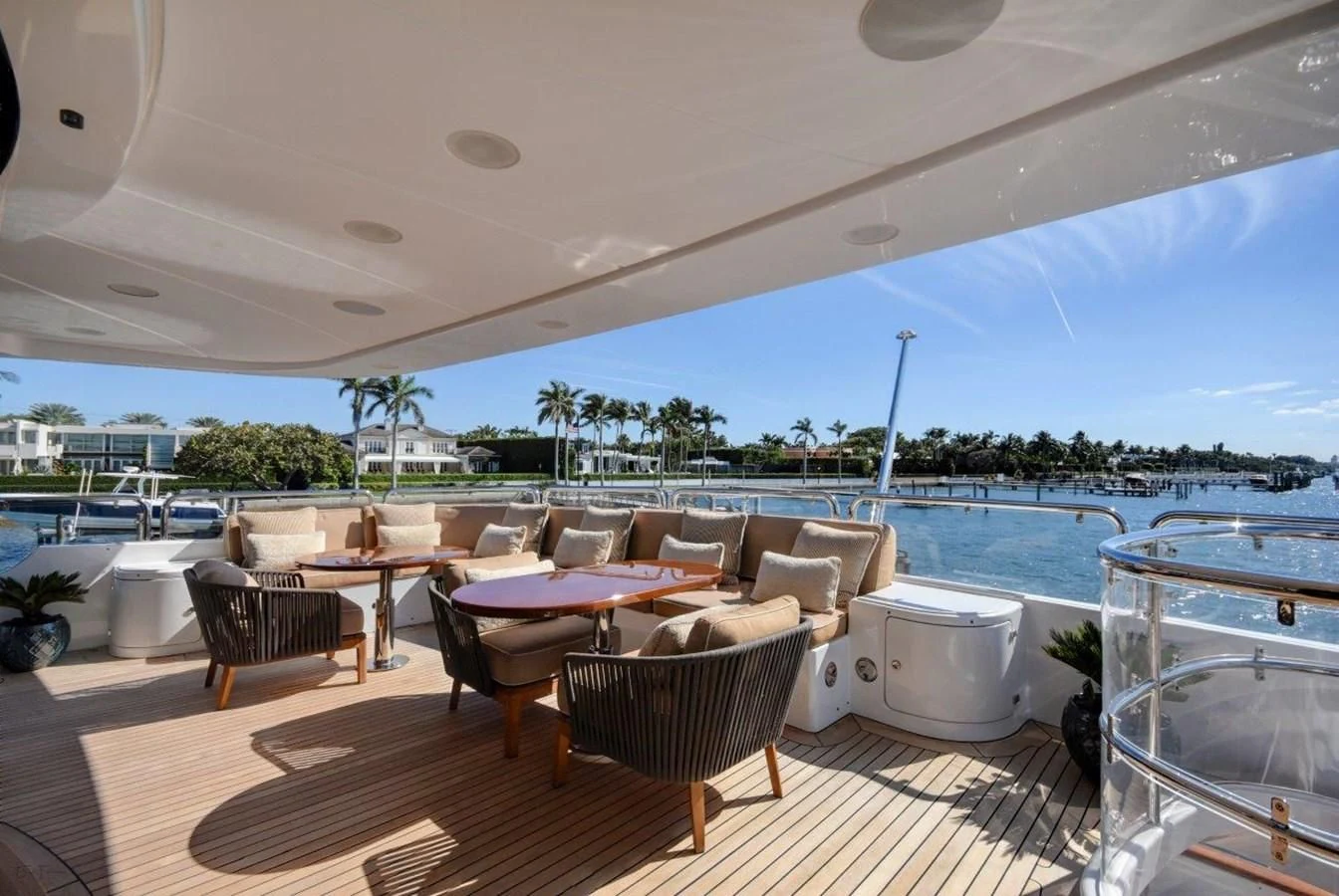 a patio with a table and chairs aboard GROOVER Yacht for Sale