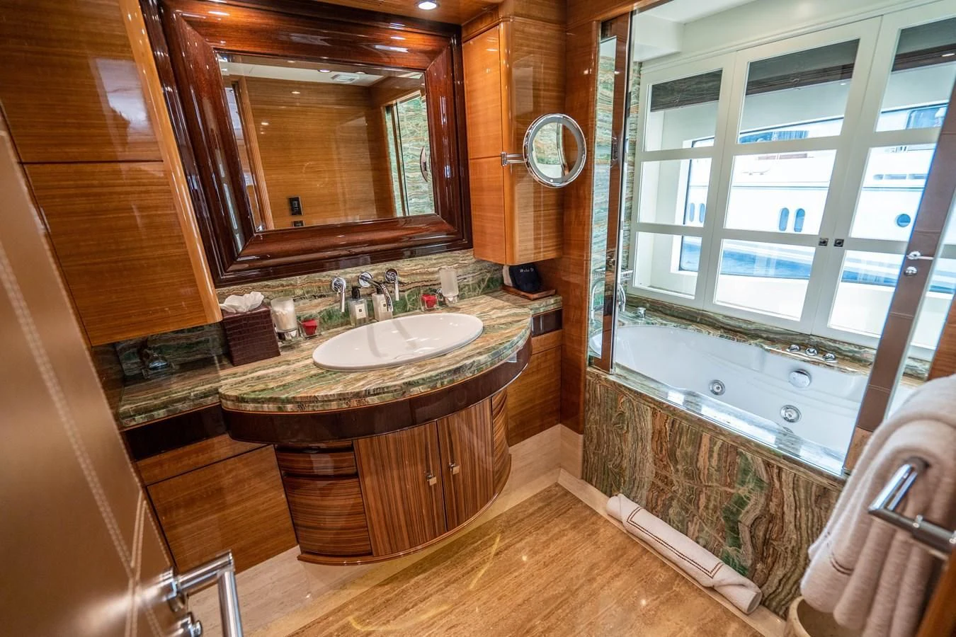 a bathroom with a sink and a bathtub aboard GROOVER Yacht for Sale