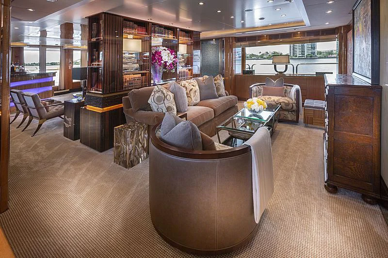 a living room with a couch and a chair aboard GROOVER Yacht for Sale