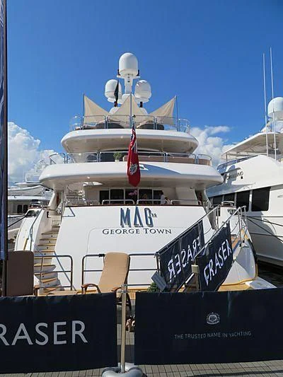 a large white boat with a red and blue flag on it aboard GROOVER Yacht for Sale