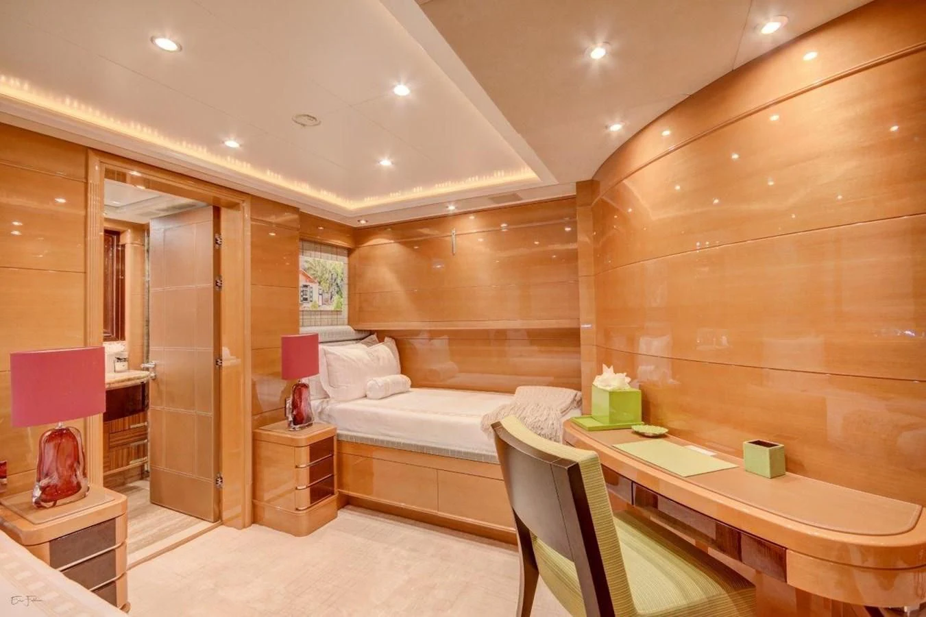a room with a bed and a table aboard GROOVER Yacht for Sale