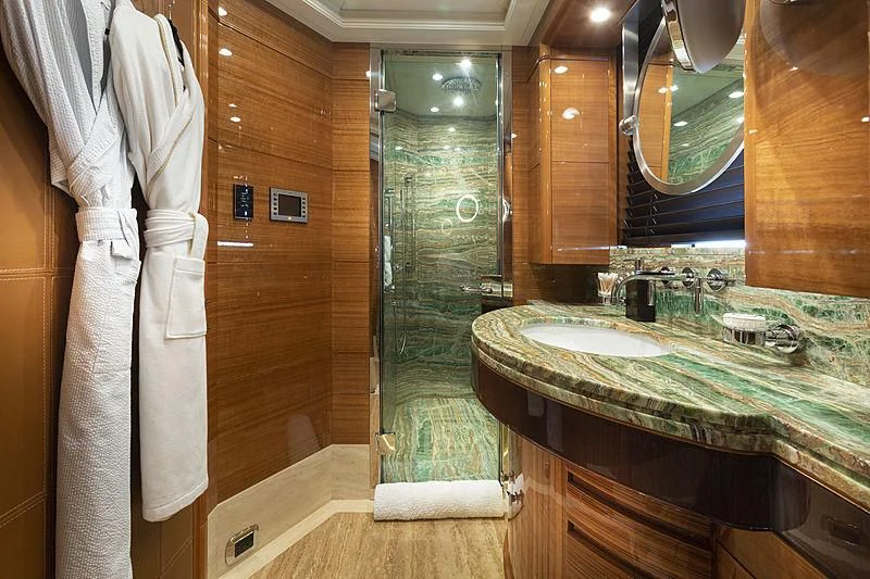 a bathroom with a large mirror aboard GROOVER Yacht for Sale