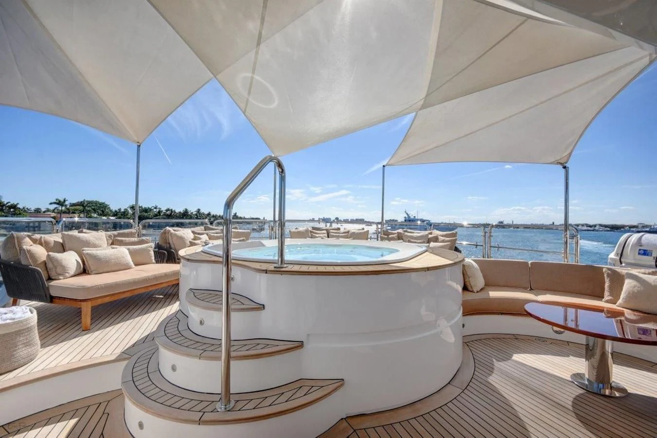 a large white tent with a table and chairs in front of it aboard GROOVER Yacht for Sale