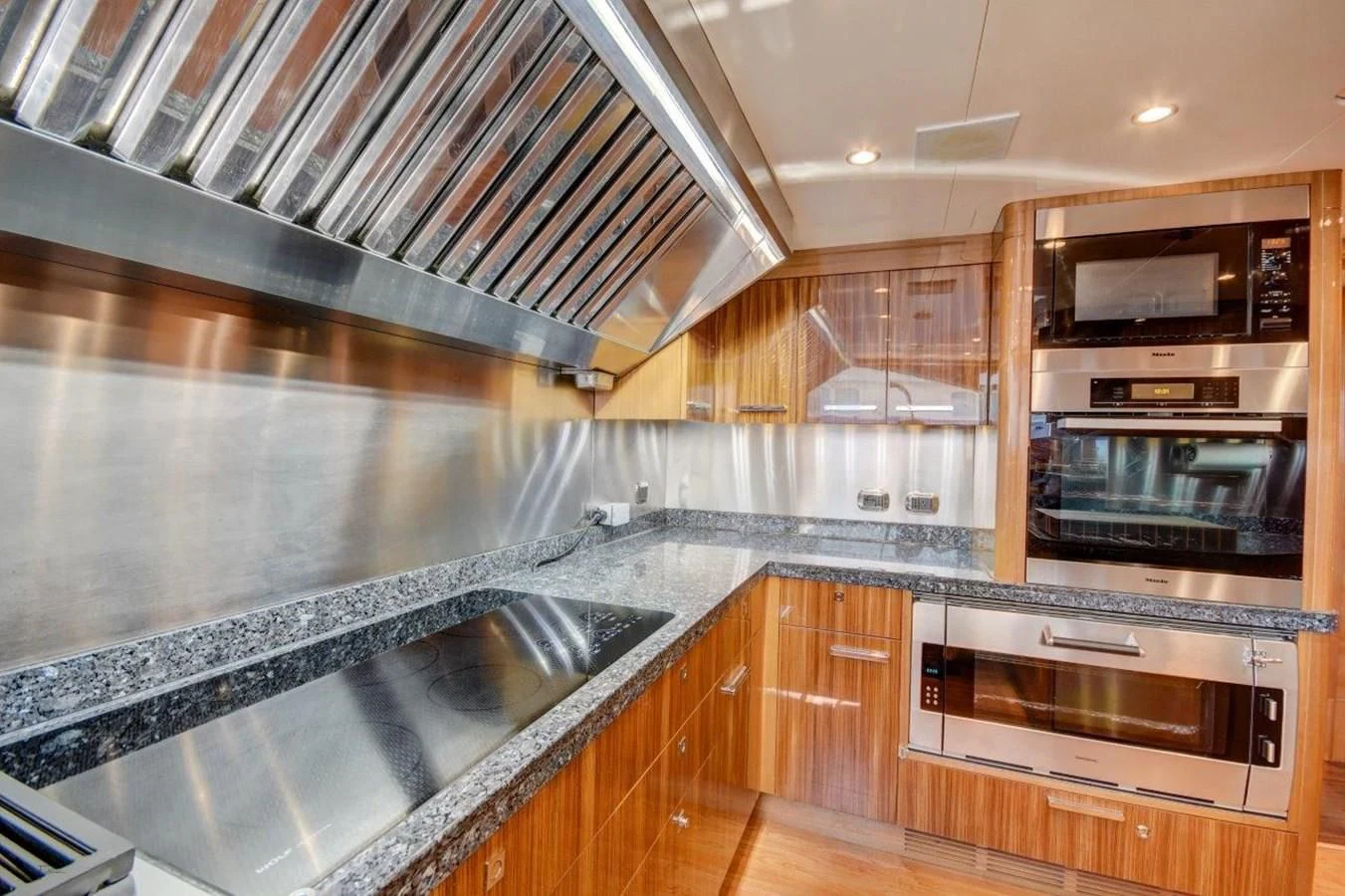 a kitchen with stainless steel appliances aboard GROOVER Yacht for Sale