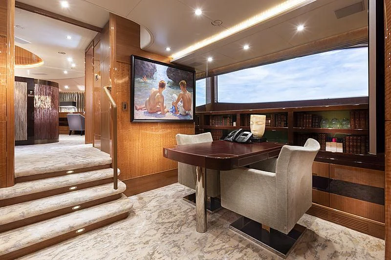 a room with a table and chairs aboard GROOVER Yacht for Sale